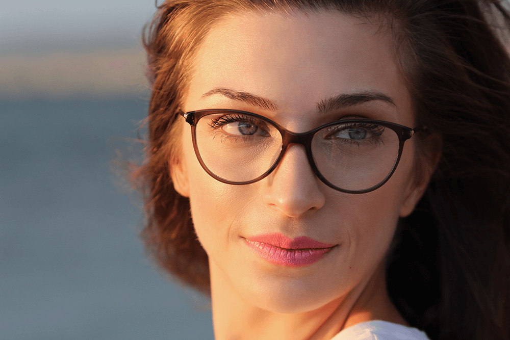 Woman in glasses at golden hour