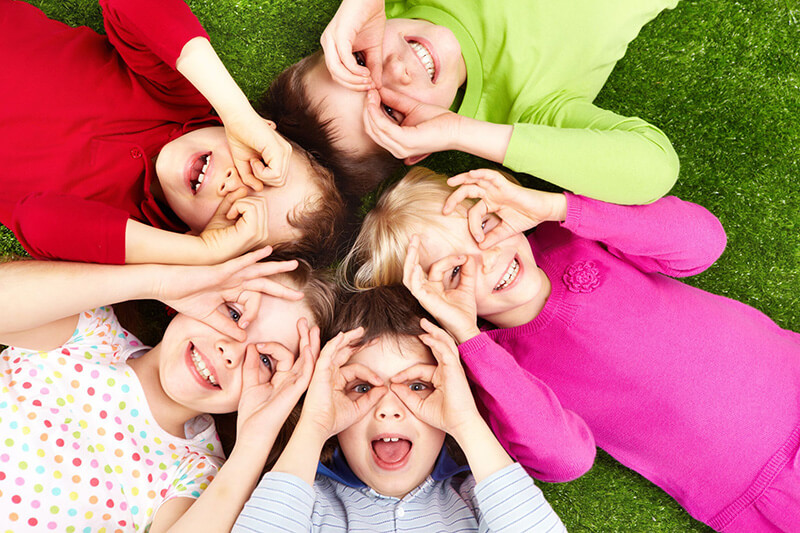 Children Laying on grass