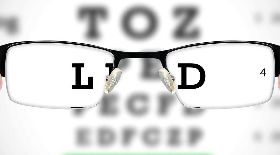 Glasses in front of eye chart