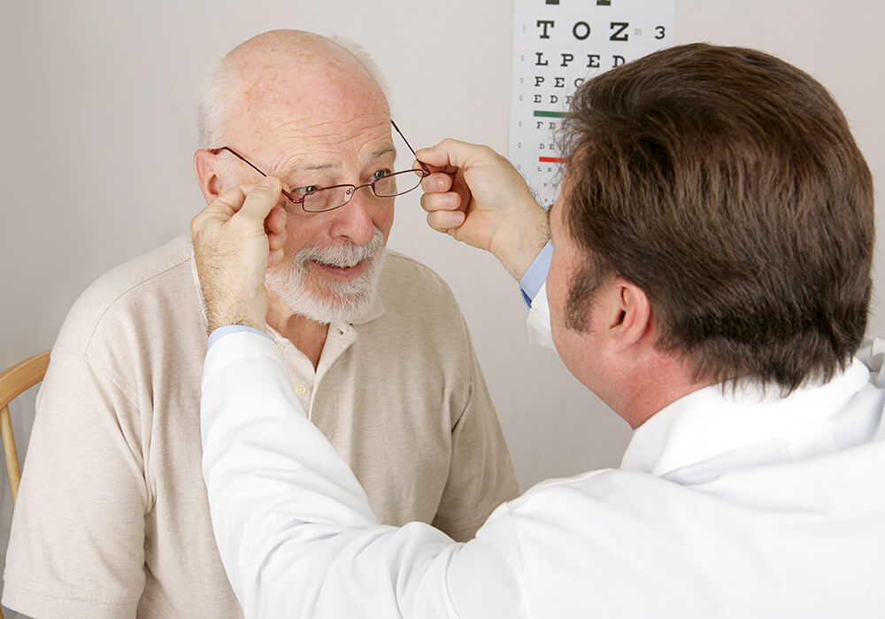 Older man getting fitted for glasses