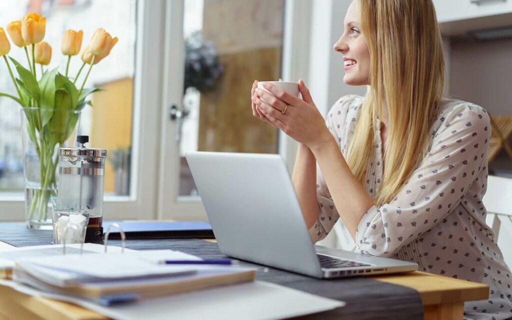 Woman in office taking coffee break