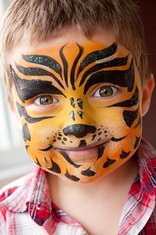 Boy with tiger face paint